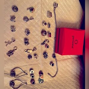 Persona bracelet by Zales with 29 charms and set of earrings with match charms